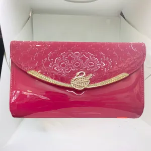 Glossy Shocking Pink Swan clutch from STYLEHEIST