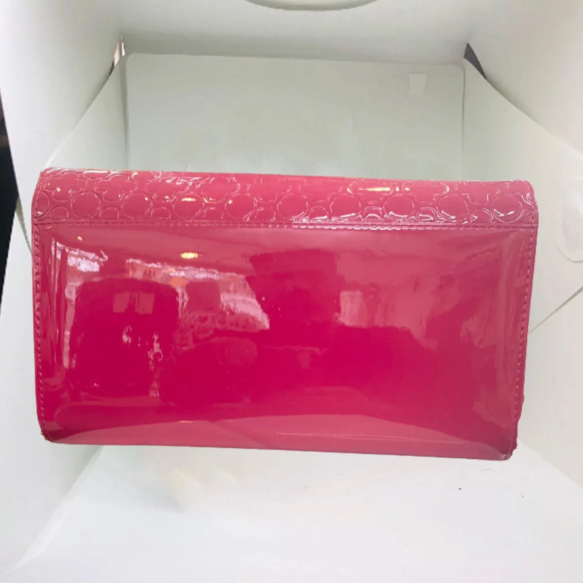 Glossy Shocking Pink Swan clutch from STYLEHEIST